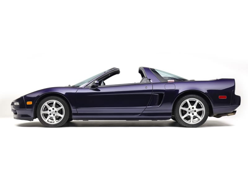 Acura NSX-T in dark purple pearl, side profile on a white studio background with the targa roof removed