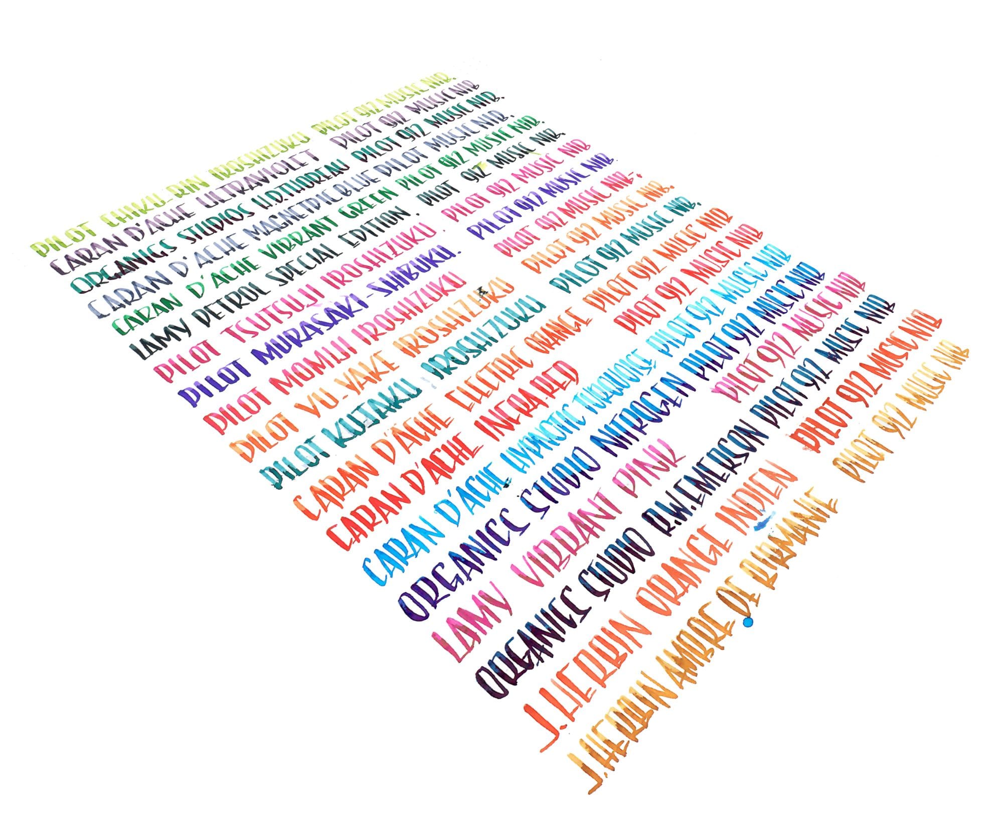 Sheet of hand-lettered ink swatches in rainbow colors, each line naming the ink and Pilot 912 music nib, photographed at an angle on white